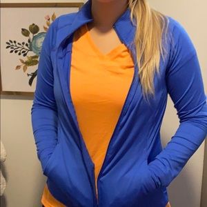 Blue fitted athleisure jacket.